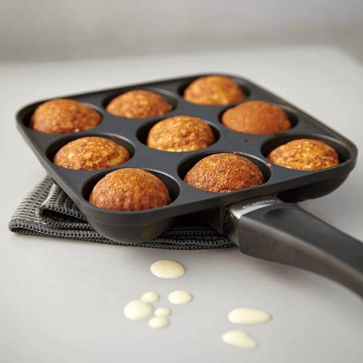 Shop a Nonstick Aebleskiver-Puff Dumpling Pan with Bakelite