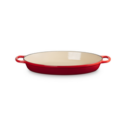 Le Creuset Signature Cast Iron Oval Baker, 3 qt. I serve whatever I made in it directly on my table for a lovely presentation