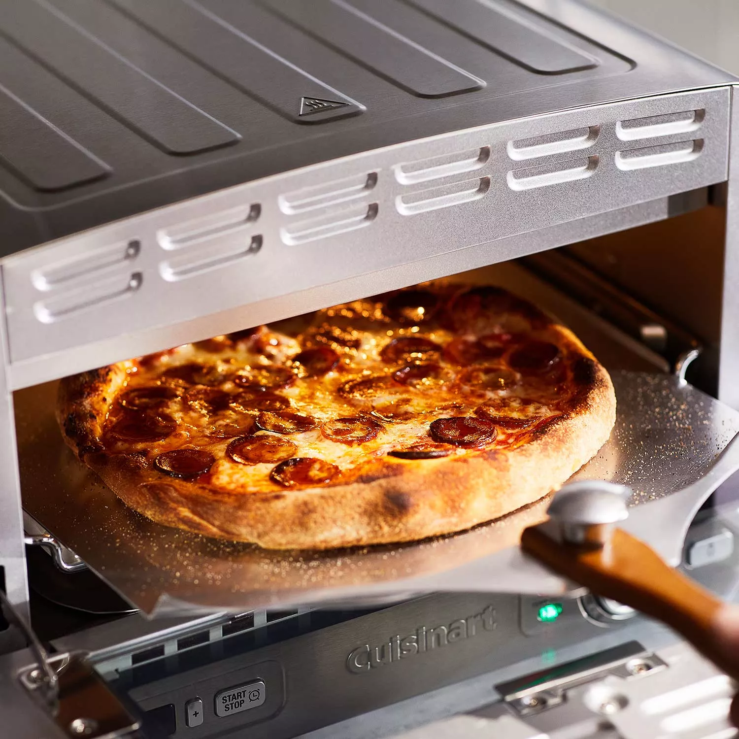 You can turn your grill into a pizza oven with this easy-to-use Cuisinart  kit