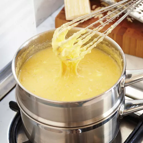 Pan Seared Scallops, Warm Tomato, Caper and Olive Relish with Creamy Polenta