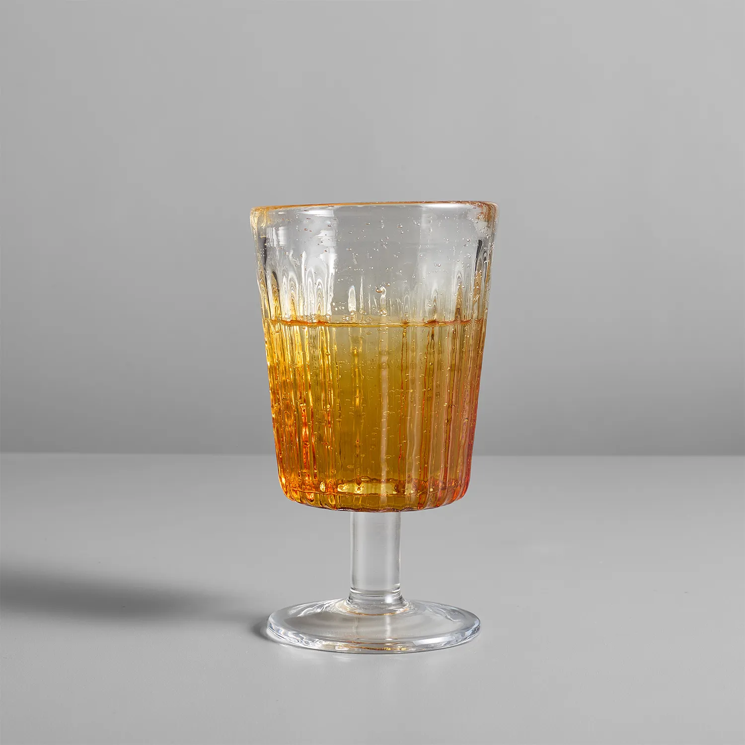 Sur La Table Amber Ribbed Goblet Glass