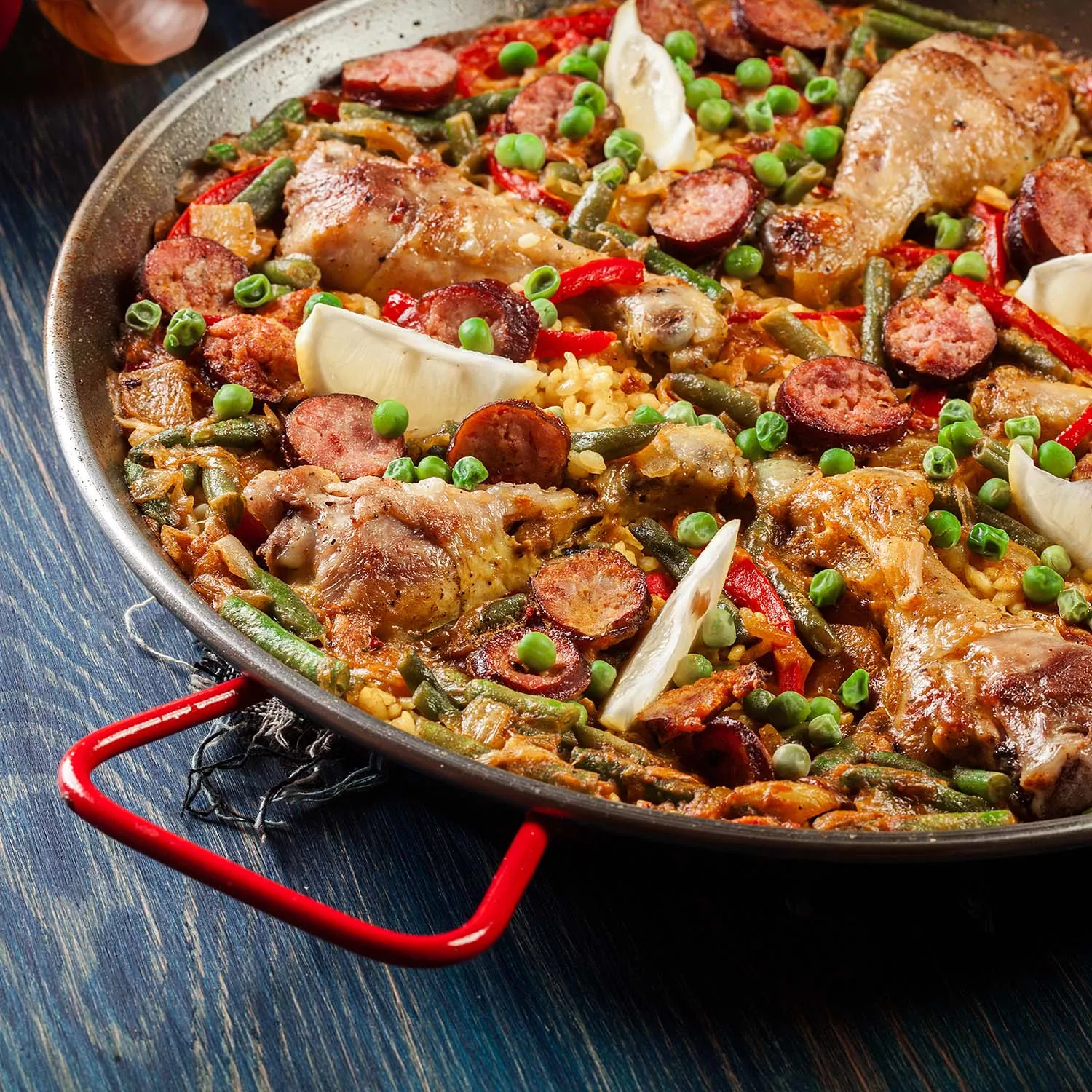 https://assets.surlatable.com/m/4ad544ed646545da/72_dpi_webp-CFA-7777683_Adobe_313686749_Chicken_Chorizo_Paella