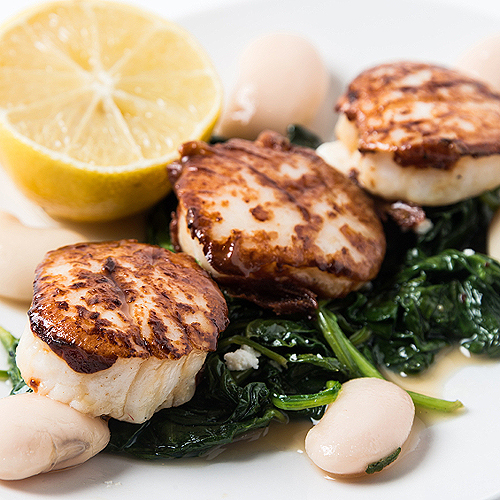 Grilled Scallops with Wilted Spinach and Lemon-Caper Butter