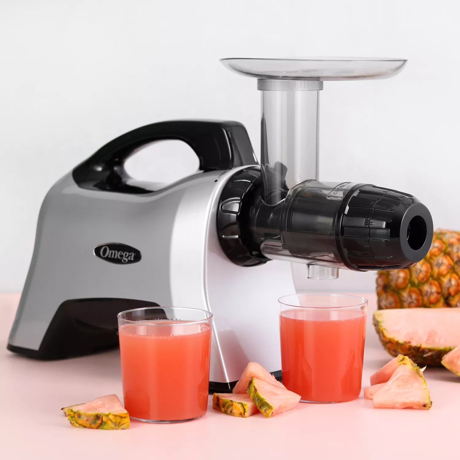 Juicer masticating outlet