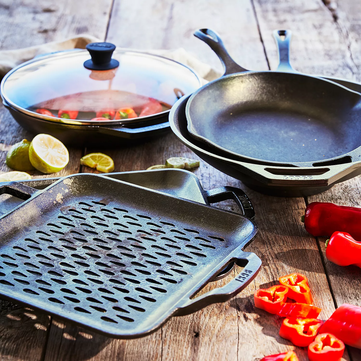 Lodge 7-Piece Essential Pre-Seasoned Cast Iron Skillet Set - Includes 10  1/4 Skillet, 10 1/4 Grill Pan, 10 1/2 Griddle, Silicone Handle Holder,  Silicone Trivet, and Two Pan Scrapers