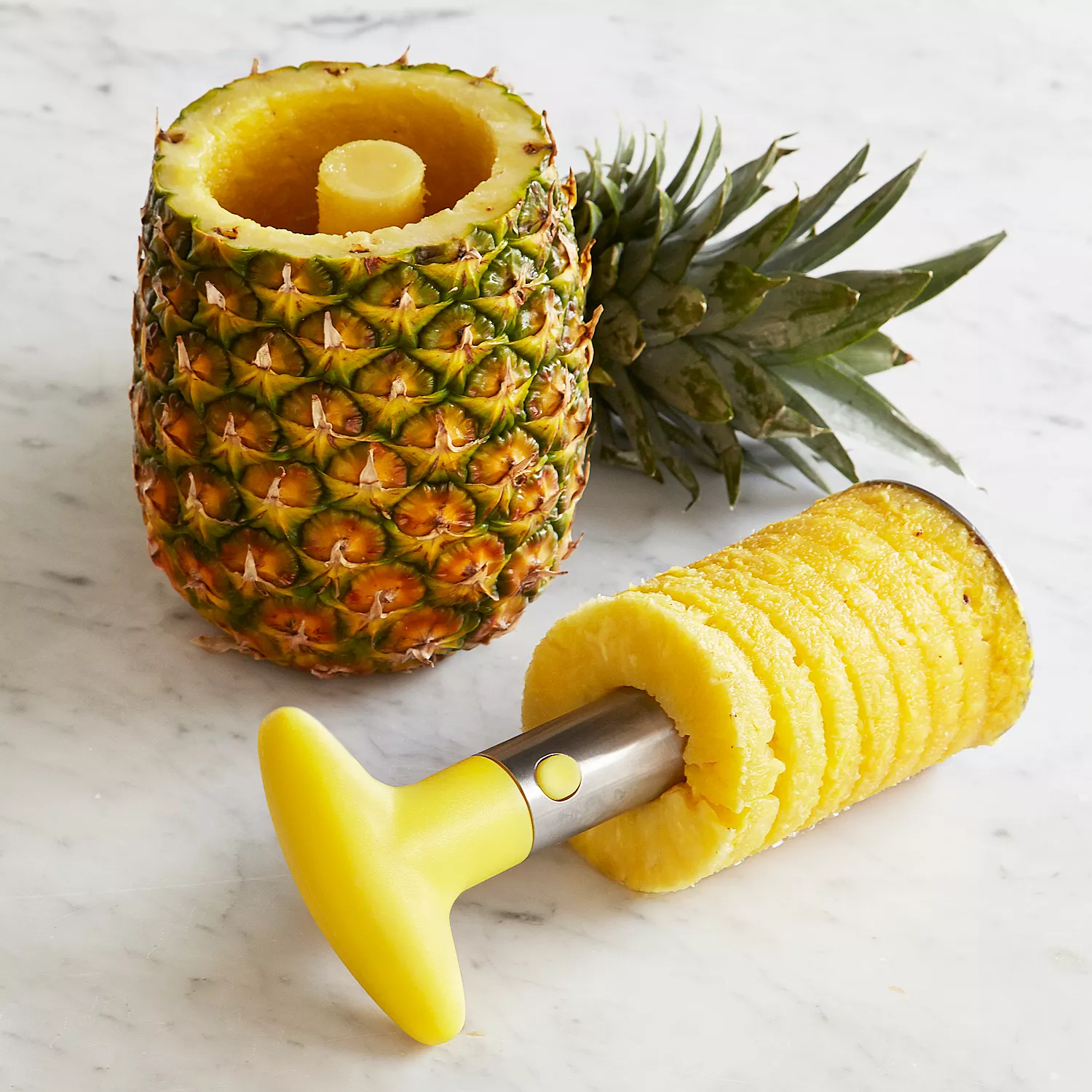 Ratcheting Pineapple Slicer, Slice perfect pineapple rings with just a  twist. Shop the Ratcheting Pineapple Slicer:  By OXO