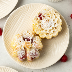 https://assets.surlatable.com/m/7b3b9c3c22cc5a57/thul-REC-507369_LemonRaspberryTeaCakes.jpg