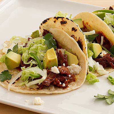 Drunken Short Ribs with Tomato Chile Sauce and Cabbage Lime Slaw