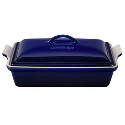 Le Creuset Heritage Covered Baker, 4 qt. Features    Stoneware maintains even temperatures and prevents scorching    Unmatched thermal resistance  safe for freezer, microwave, oven, broiler and dishwasher    Dense stonewa