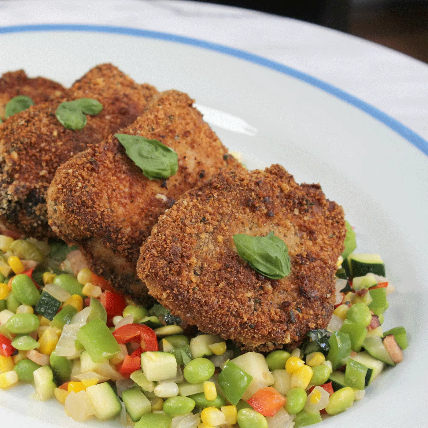 Herb Crusted Pork Chops with Fava Bean and Corn Succotash